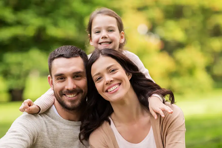 young family smiling, example of family law clients - Highland, IL